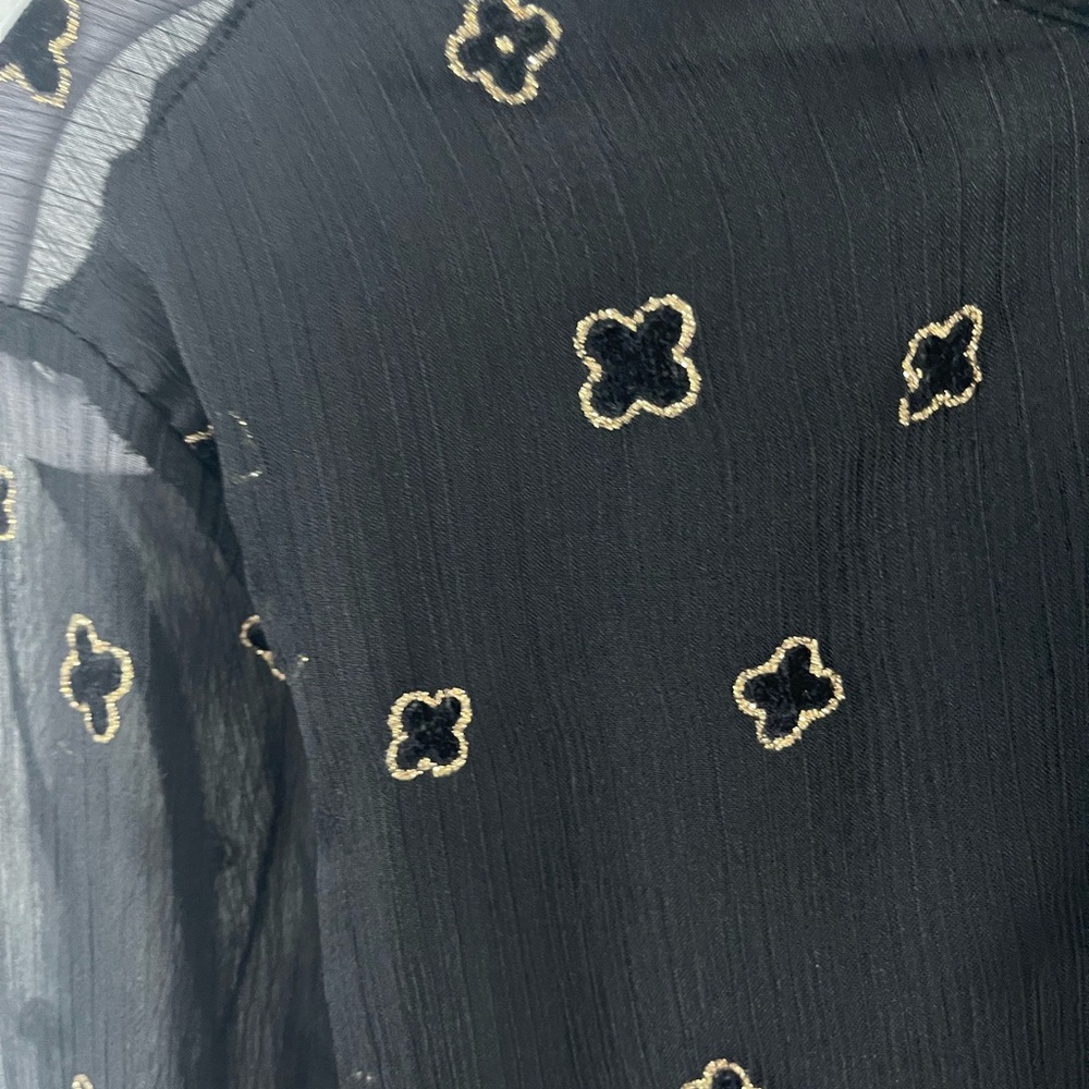 Elegant Black Sheer Blouse with Gold Accents